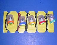 A completed set of buttons wrapped around a cable storage board