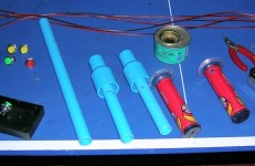 PVC water pipe, buttons, a mercury switch, wire, pipe glue, and Ultraman motorbike handgrips